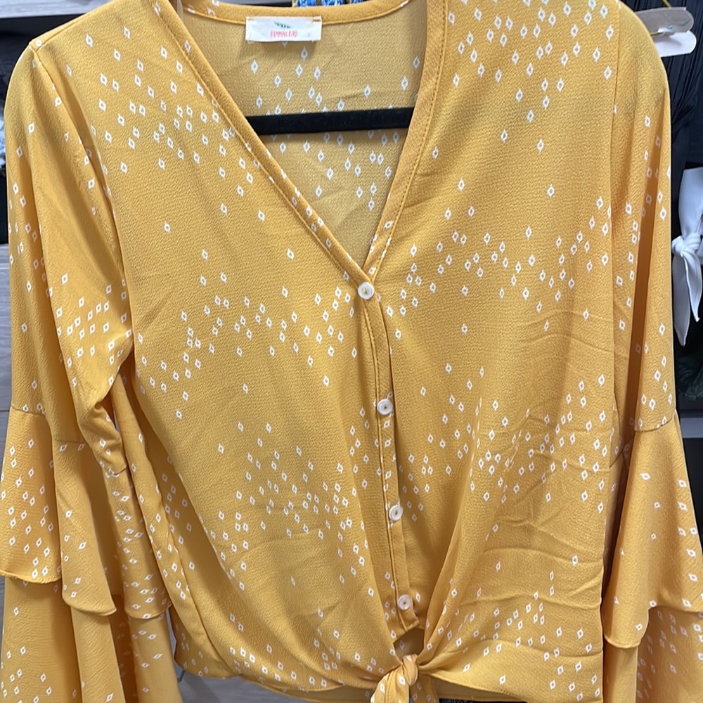 Blouse- ruffled sleeve and tie on waist.